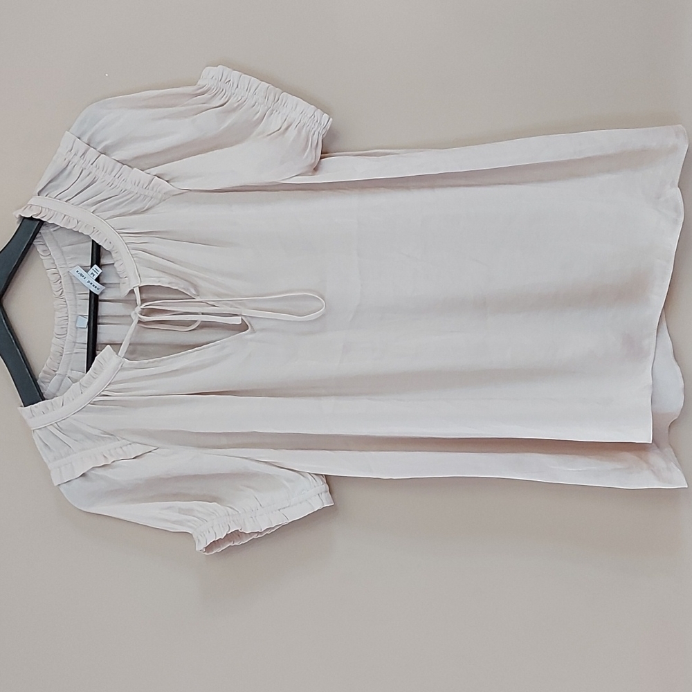 Naked Zebra blouse with tie front closure ruffle detail on the sleeve and collar